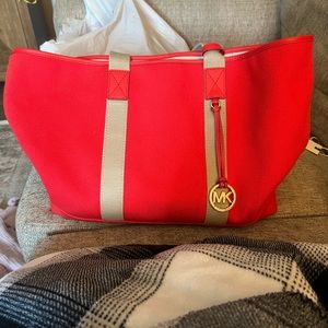 Michael Kohrs tote bag. Red orange color